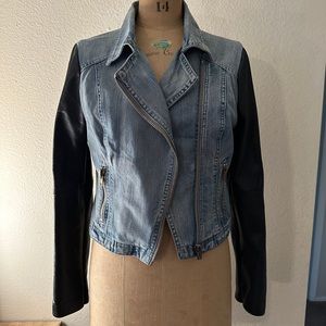Denim moto jacket with leather sleeves.